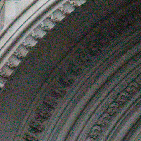 The carving round a cathedral door at ISO 8000, at 1:1, as the camera recorded it