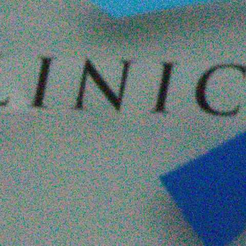 Lettering on a white panel at ISO 16000, at 1:1, as the camera recorded it